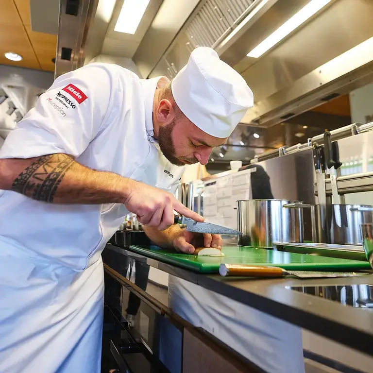 Noah Wynants cooking at the SPYCA Competition Regional Final.