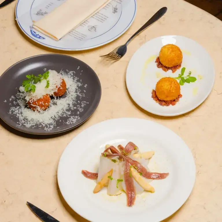 Dishes at Sabor, including croquetas.