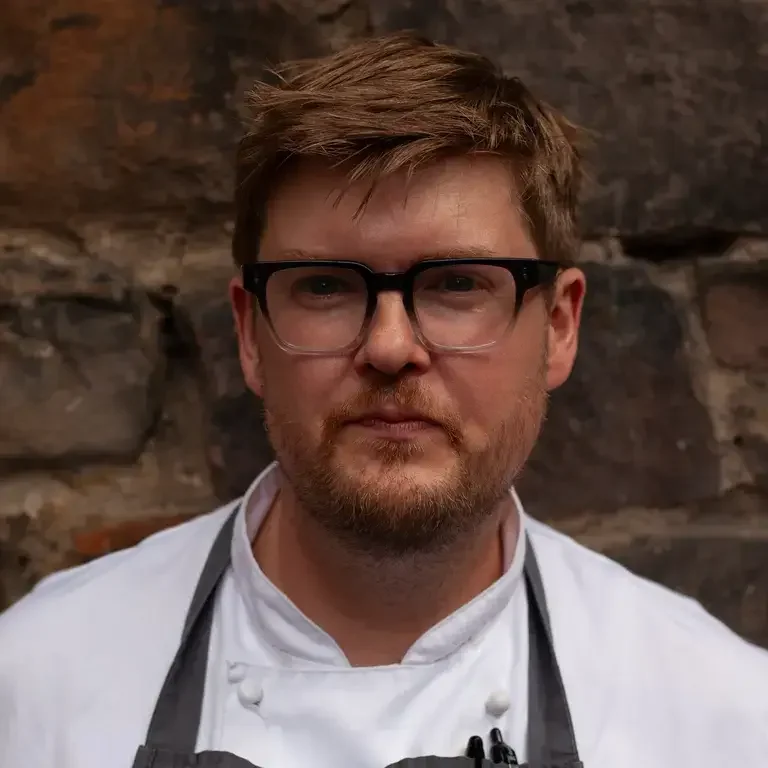 Chef Bart Stratfold, wearing glasses.