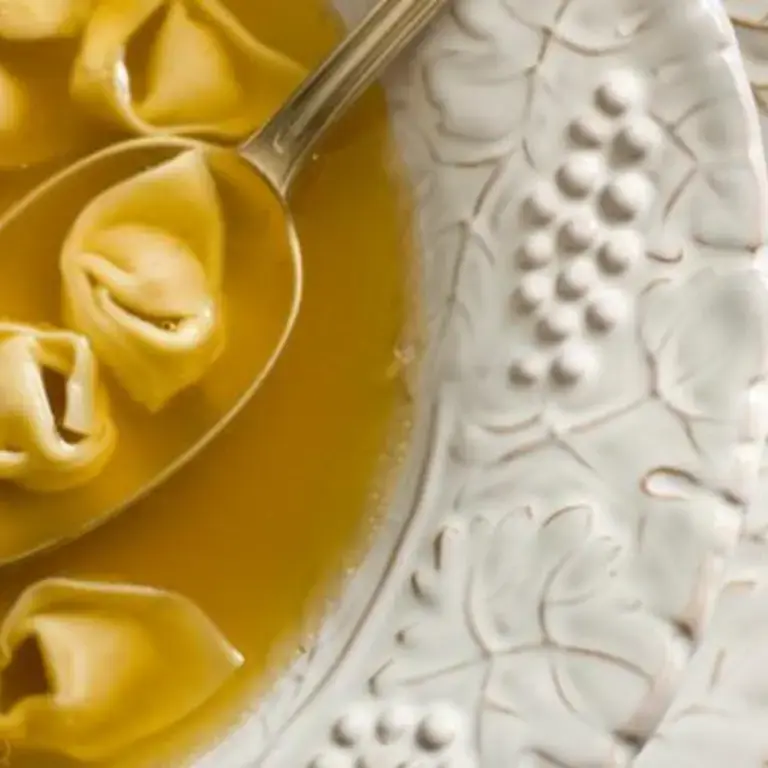 Tortellini in brodo with a spoon.