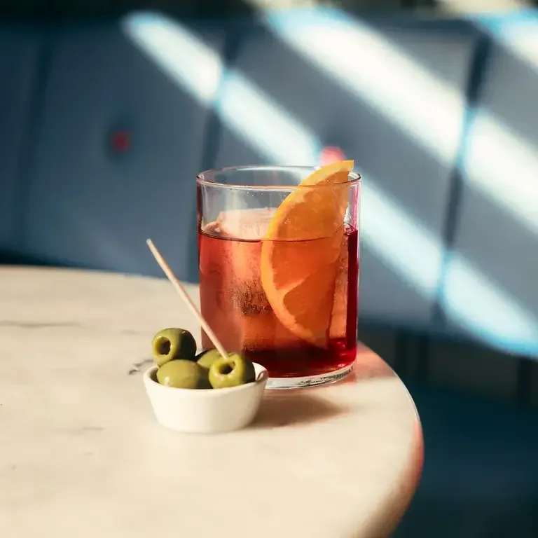 Negroni and olives ay Hey Palu in Edinburgh.