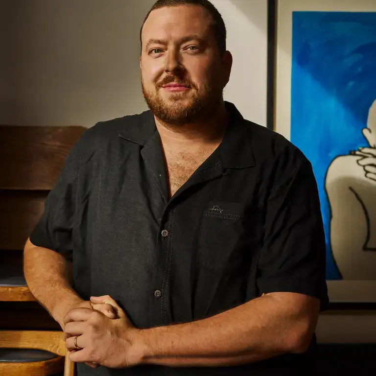 Chef Mike Davies in a dark, short-sleeved shirt.