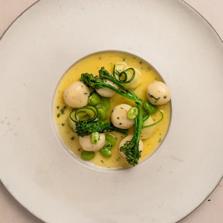 Gnudi with spring vegetables and lemon butter sauce by Stuart Ralston.