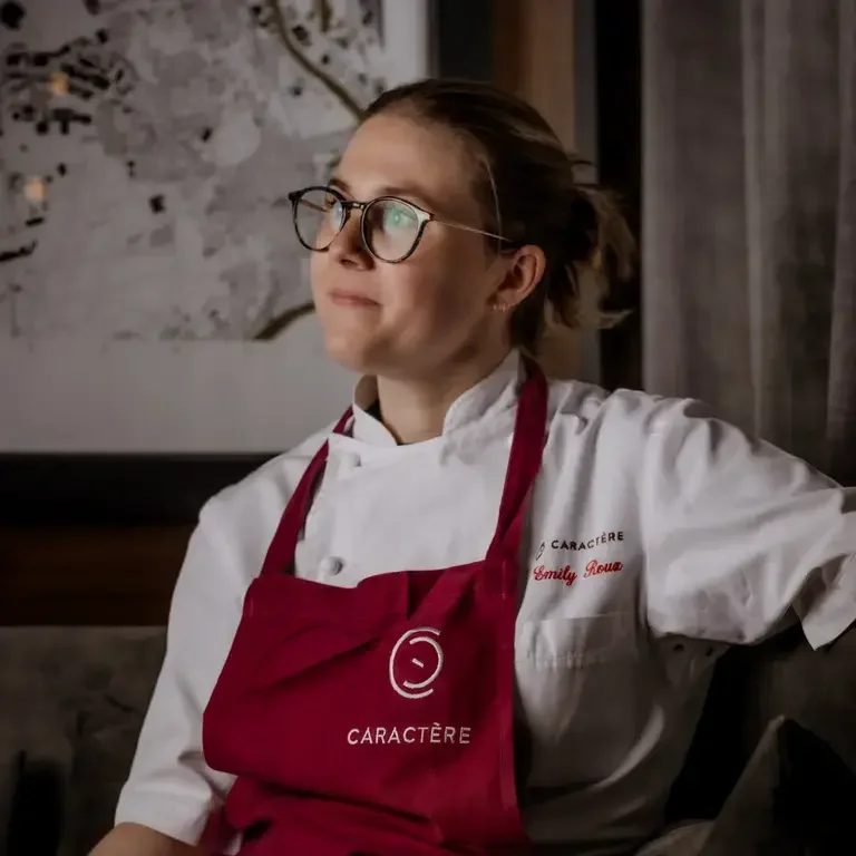 Chef Emily Roux in a red apron.