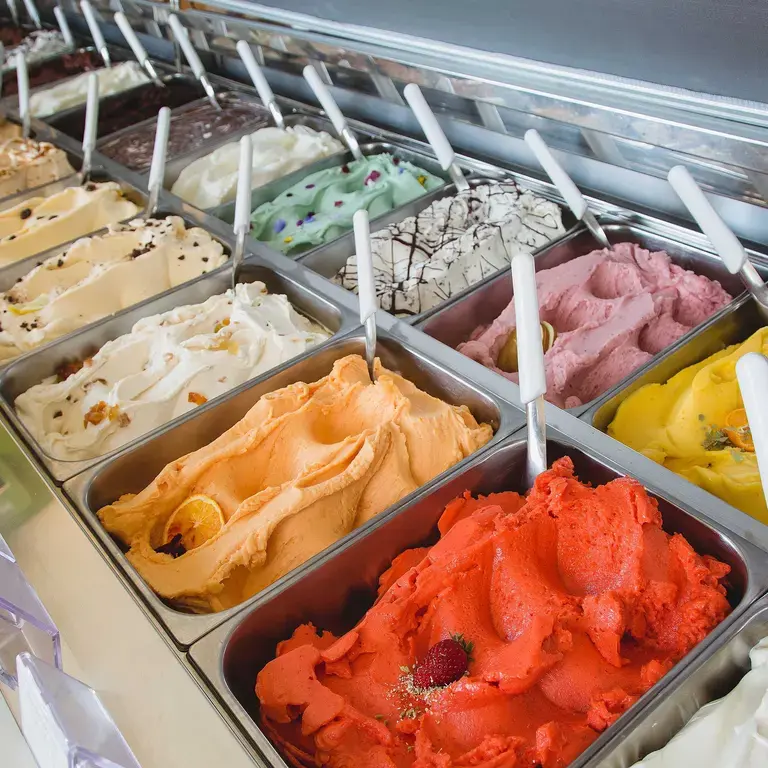 Multiple gelato flavours at L'Albero dei Gelati.