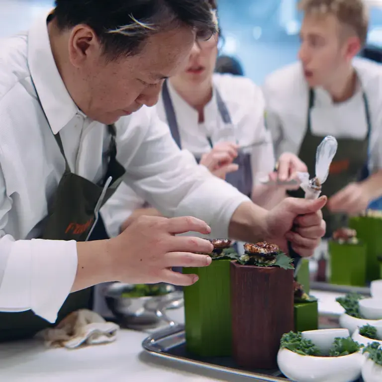 Chef Takahiko Kondo preparing food at Firecat.