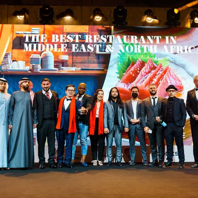 A restaurant team on stage.