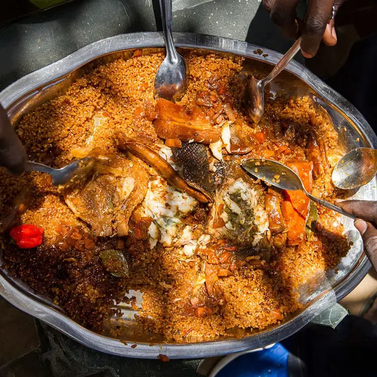 overhead-shot-large-platterof-food-with hands-holding-spoons