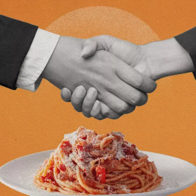gastro-diplomacy-handsshake-over plate-of-spaghetti