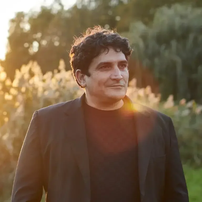 Chef Mauro Colagreco in a sunny garden.