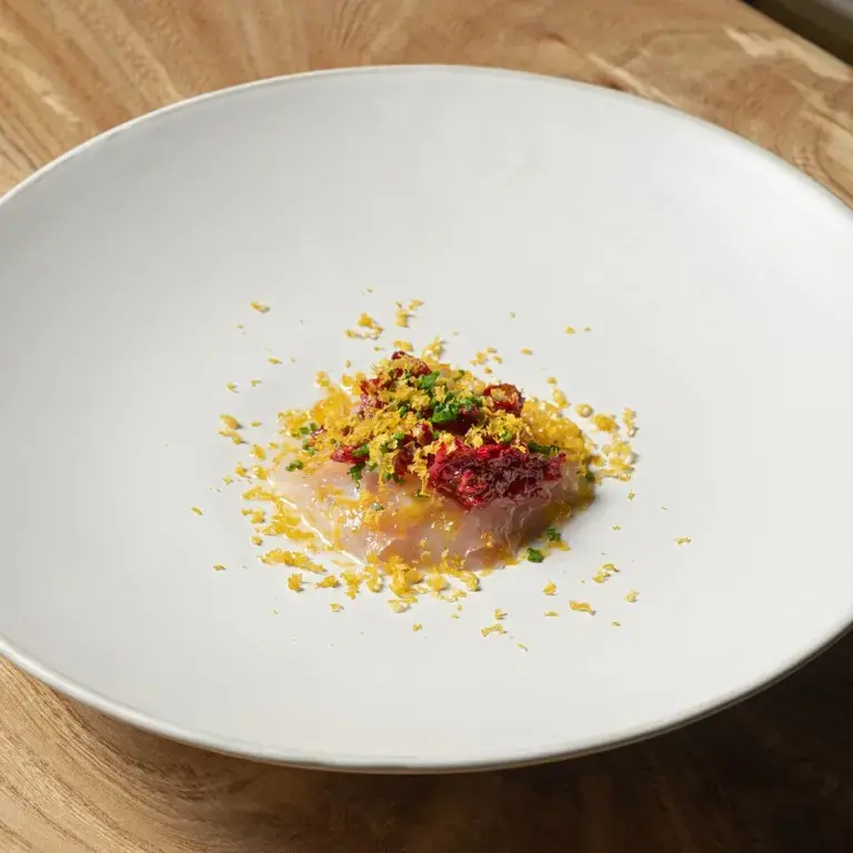 Sea bass, bottarga, dried berries and kombu at Bossa in London.