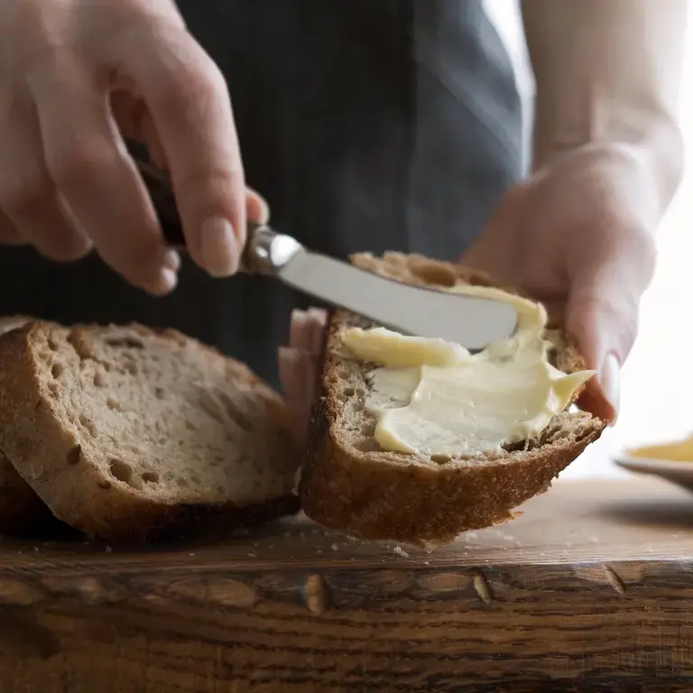 butter-being-spread-on-bread-with-butter-knife