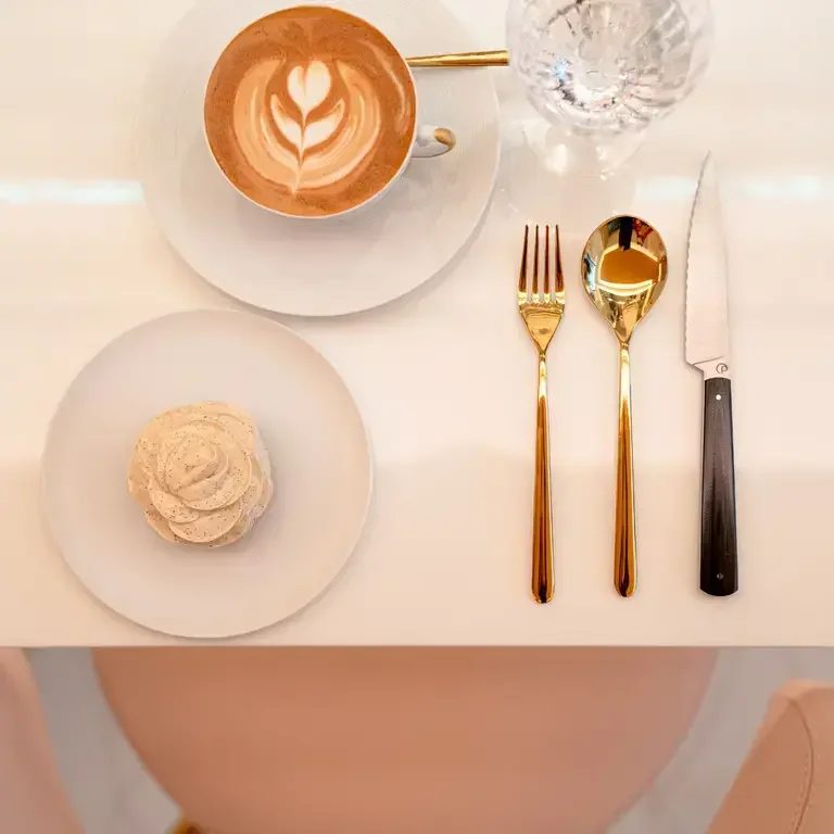 A table setting with coffee and cake at Cedric Grolet at The Berkeley.