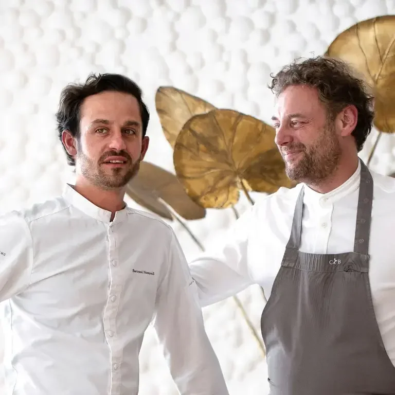 Potrait of chefs Arnaud Donckele &amp; Bertrand Noeureuil standing side by side