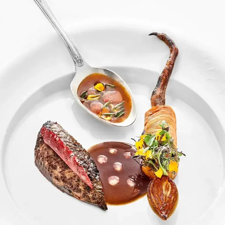 a close up of a fine dining dish at Plénitude