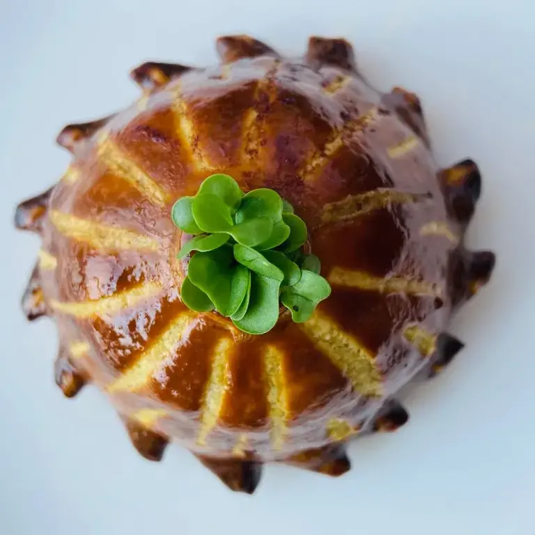 Dish of quail pithivier, mushroom duxelles, foie gras and Madeira sauce by chef Celia Stoeklin.
