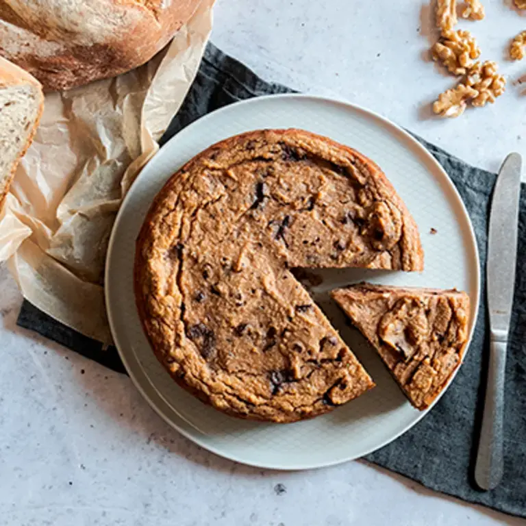 A cake with a slice removed.