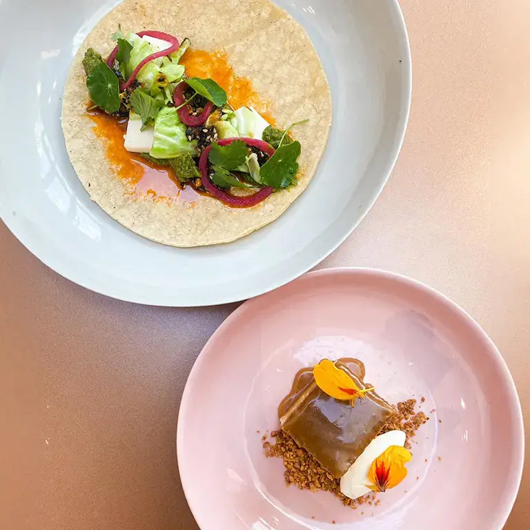 Corn tortilla with spiced and roasted cauliflower stems by OzHarvest Sydney.