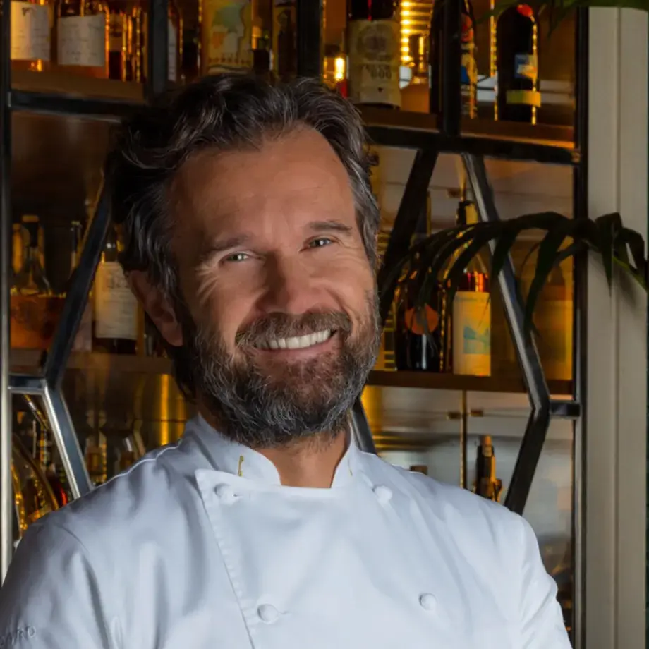 Chef Carlo Cracco, smiling.