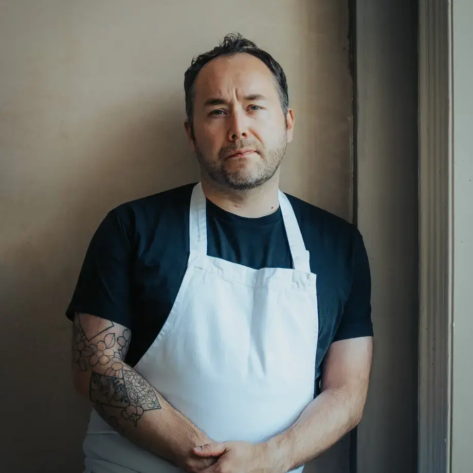 Chef Stuart Ralston in an apron.