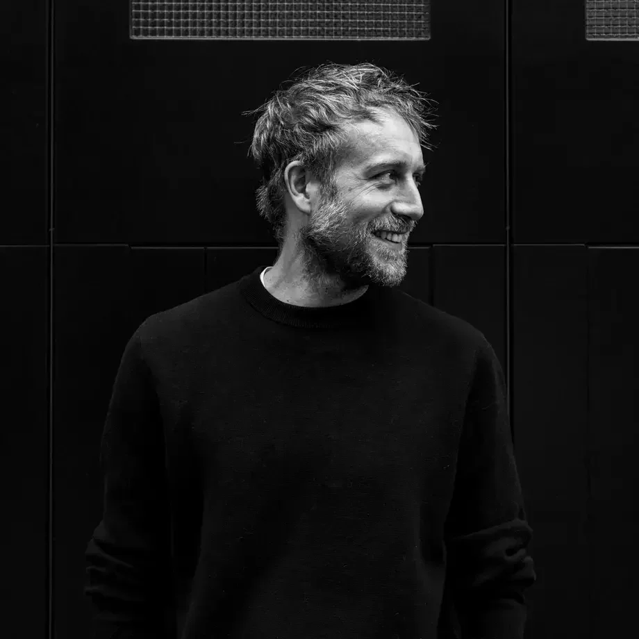 Chef Rob Roy Cameron looking sideways in a dark sweatshirt.