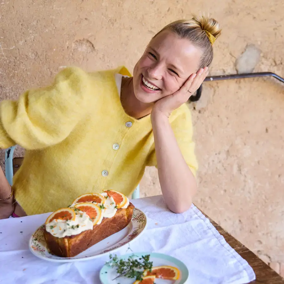 Xanthe Ross smiling in a yellow jumper.