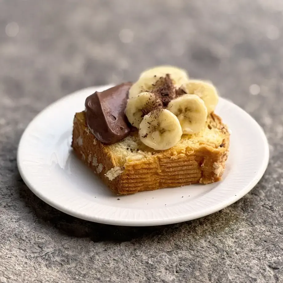 Colomba with chocolate mousse, bananas and chocolate curls.