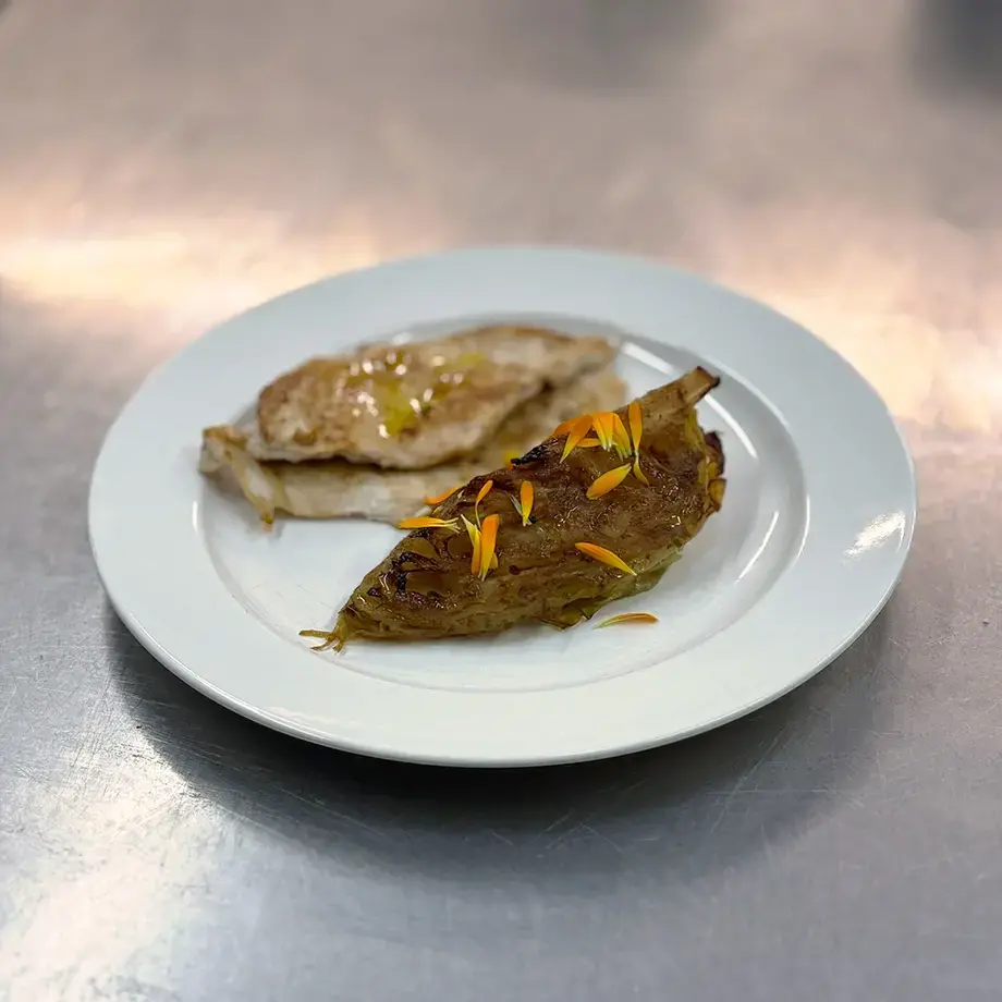 Grilled chicken with glazed cabbage.