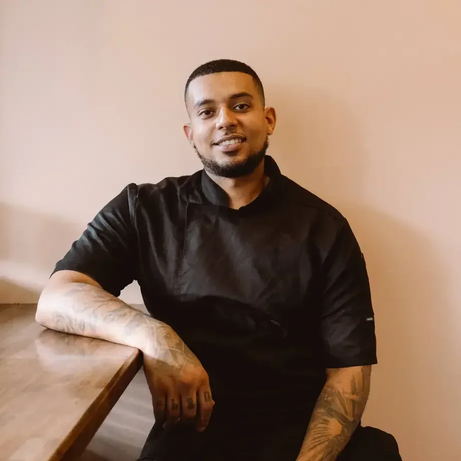 Chef Nathaniel Mortley in black chef's clothes.