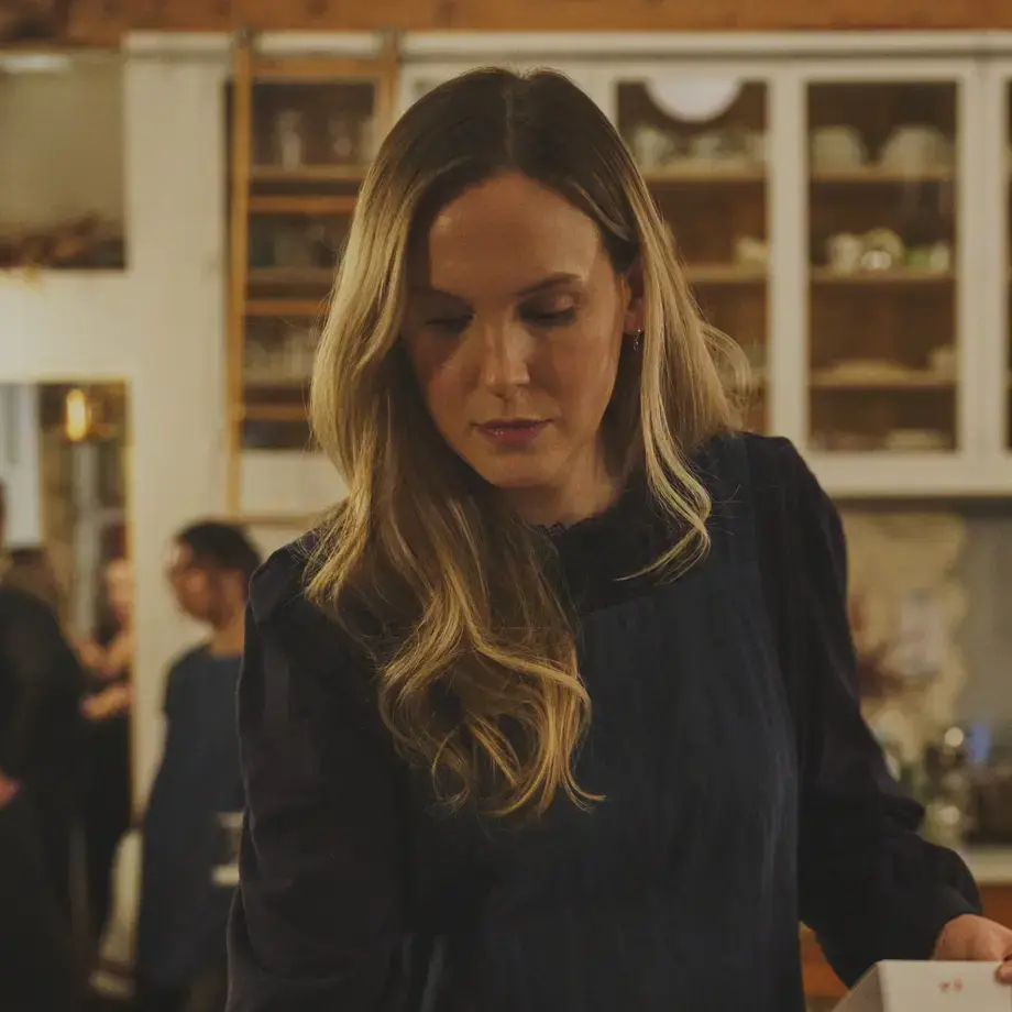 Creator Anna Laverty setting a table.