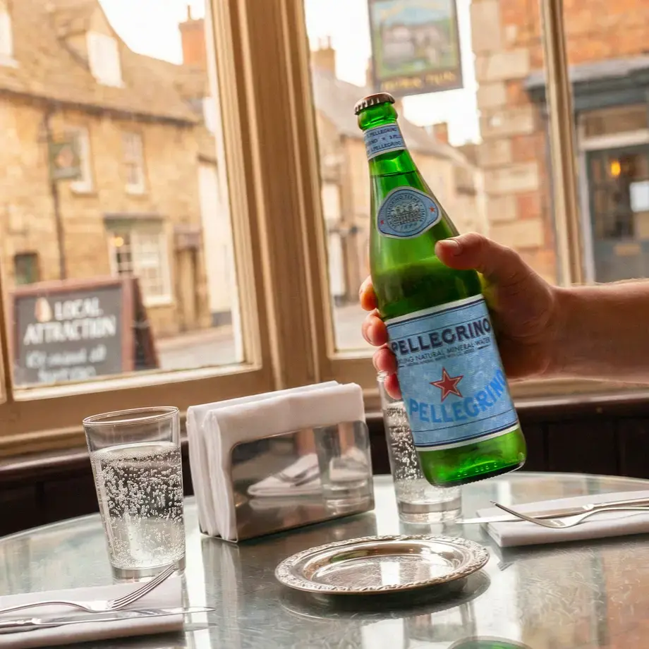 S.Pellegrino at a restaurant table in an English village.