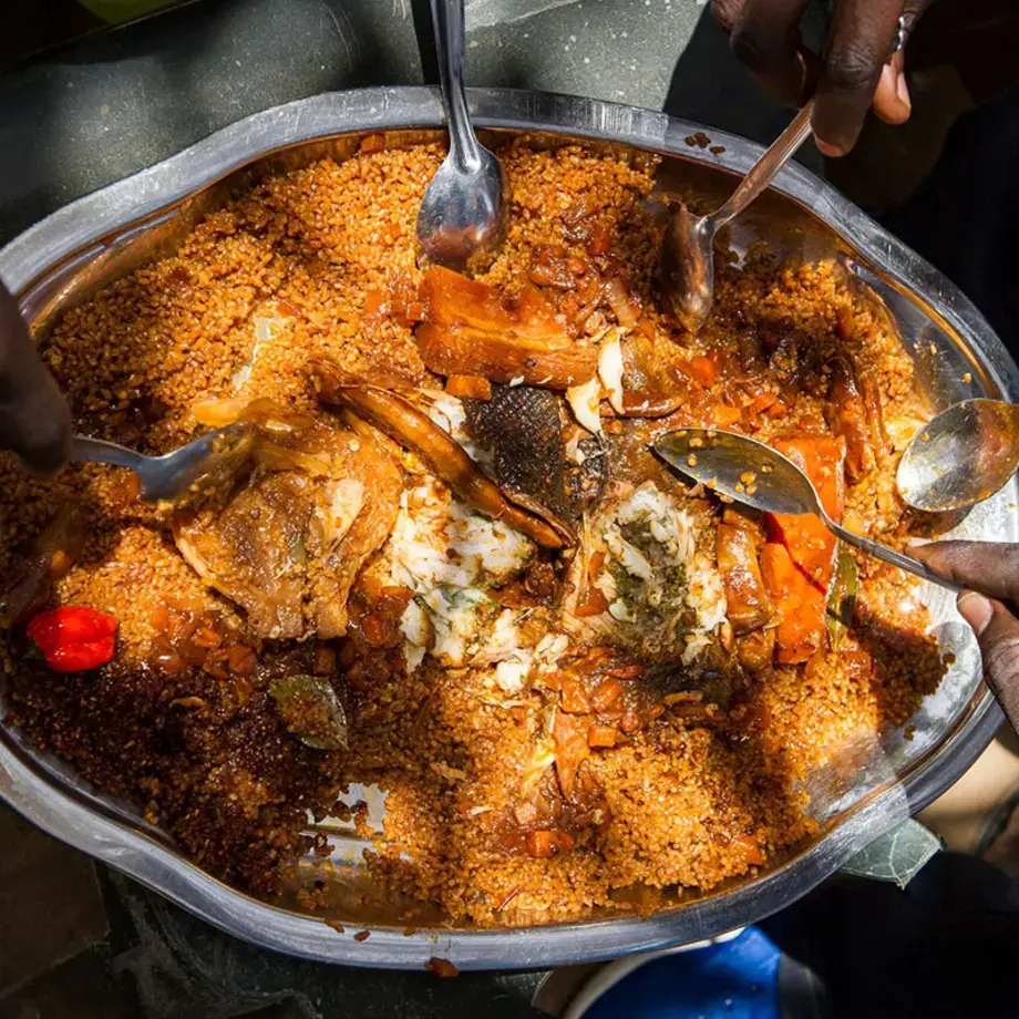 overhead-shot-large-platterof-food-with hands-holding-spoons
