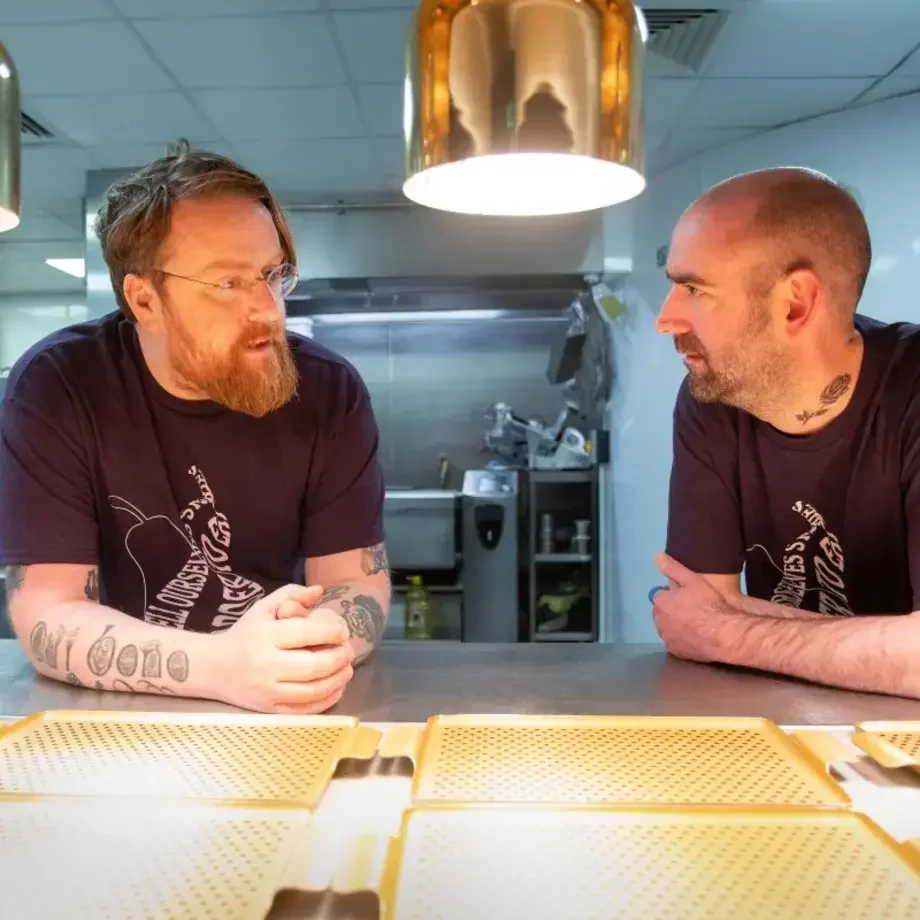 Chefs JPMcMahon and Andy McFadden in a kitchen.