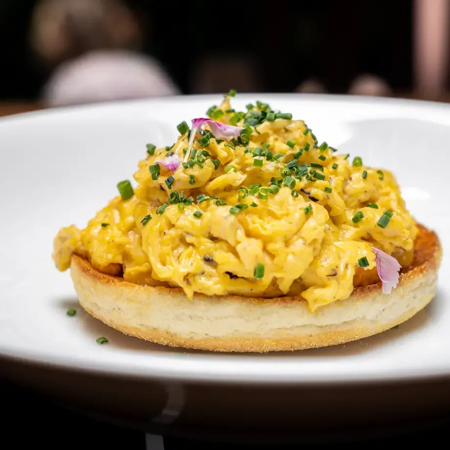 Creamy scrambled eggs on a muffin.