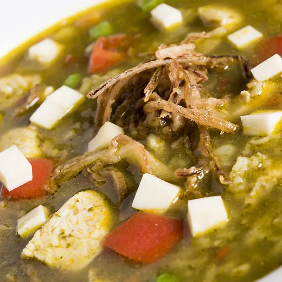 bowl of broth with meat and vetetables from above
