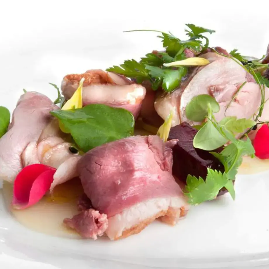 Layers of Medium Rare Duck Breast And Thigh With Sprouts And Red Beets, On A Bed Of “Interestingly Sour” Potatoes