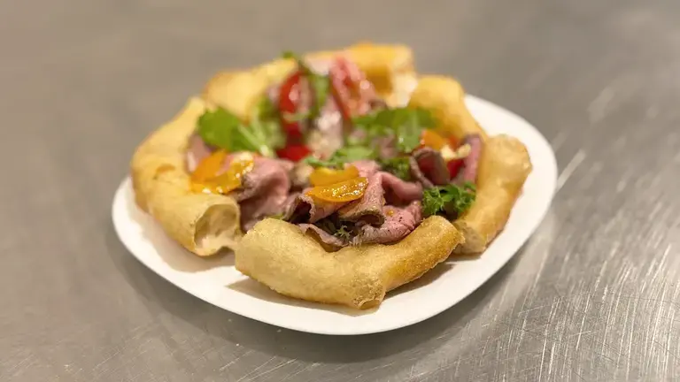 Fried pizza with vitello tonnato plated