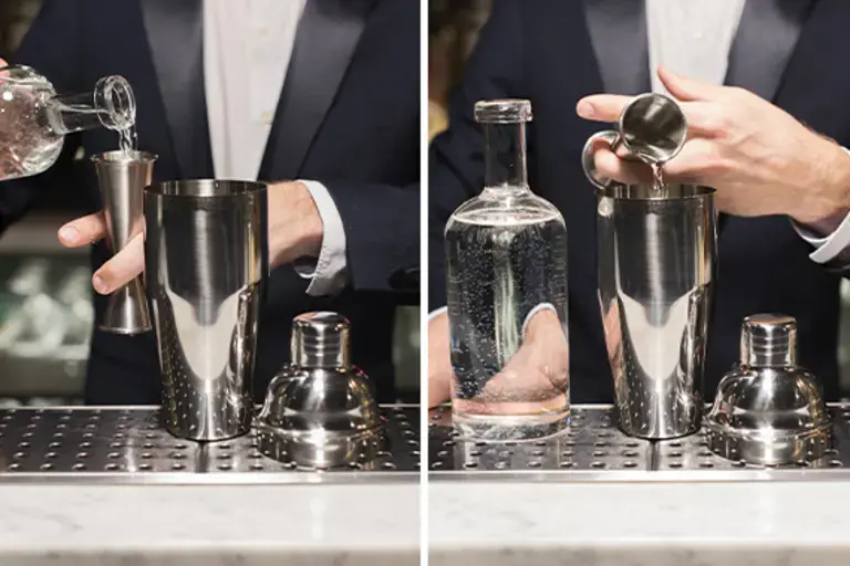 measuring and pouring vodka into a shaker