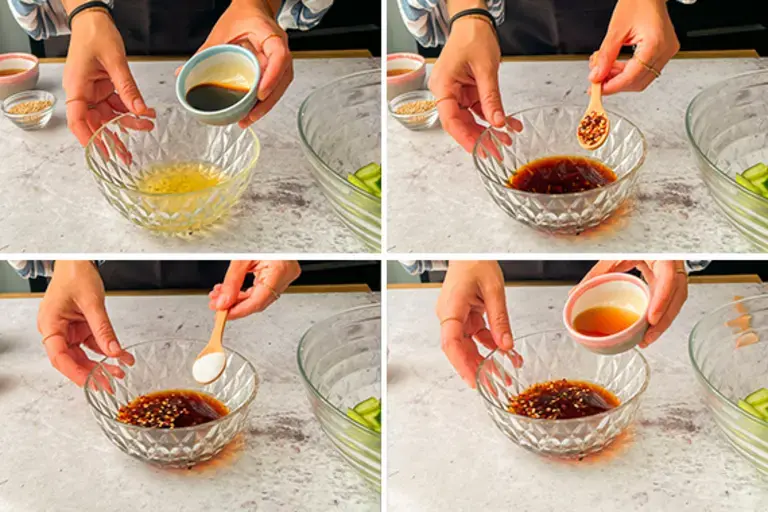 Chef adding soy sauce to cucumbers.