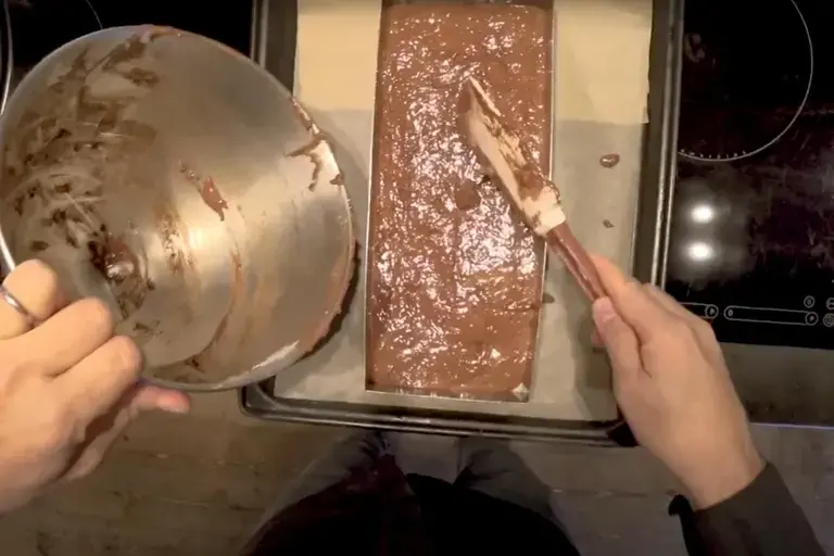 dough into a baking frame for chocolate truffle slice recipe