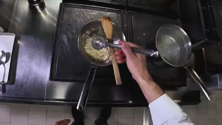 adding hot water to the rice