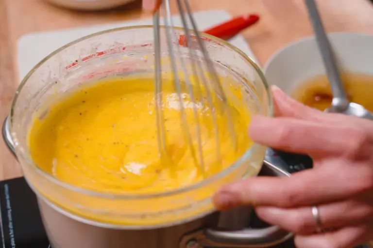 Cooking eggs in a bain-marie for carbonara.