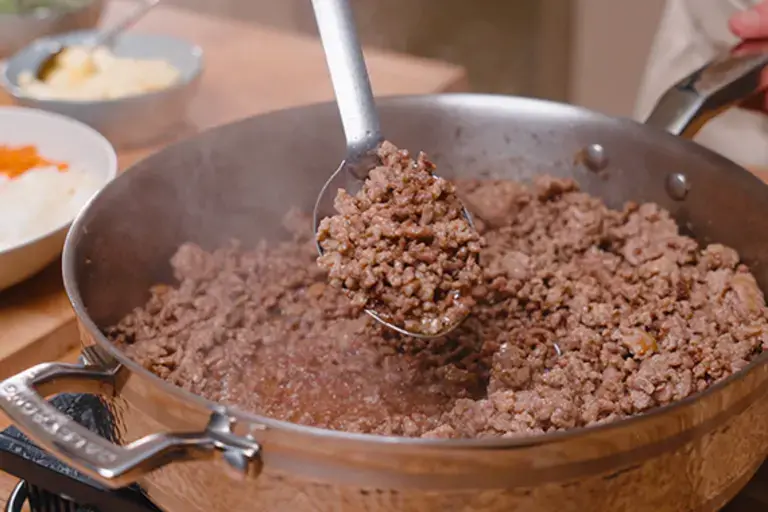 Cooking ragù.