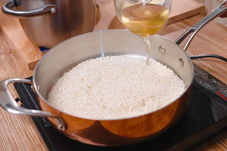 Adding the white wine.