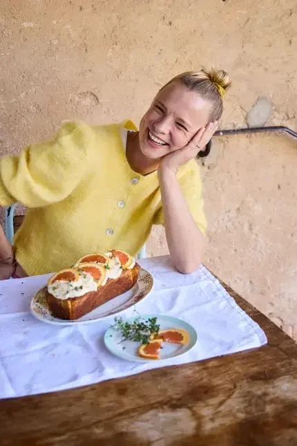 Xanthe Ross smiling in a yellow jumper.