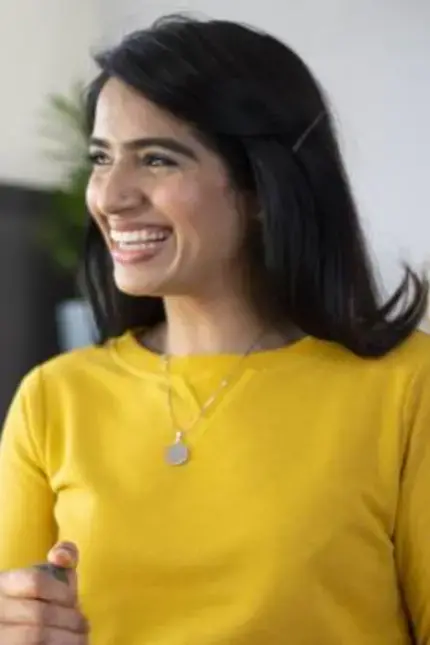 Chef Monica Haldar in a yellow sweater.