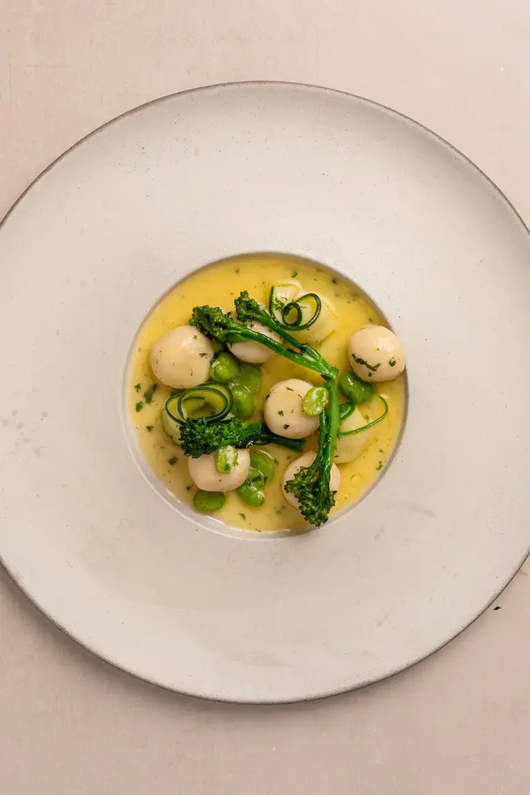Gnudi with spring vegetables and lemon butter sauce by Stuart Ralston.