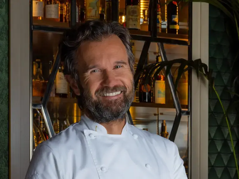 Chef Carlo Cracco, smiling.