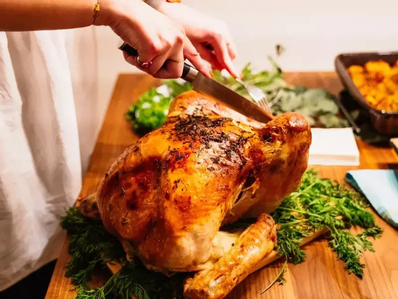 A Christmas turkey being carved.