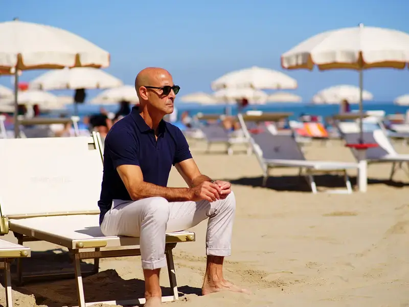 Stanley Tucci on the beach in Italy.